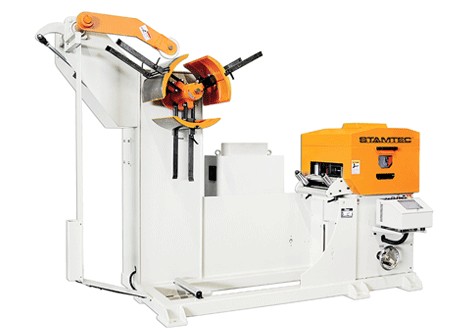 Stamtec industrial coil handling machine with orange and white components used for feeding and straightening metal sheets in manufacturing.